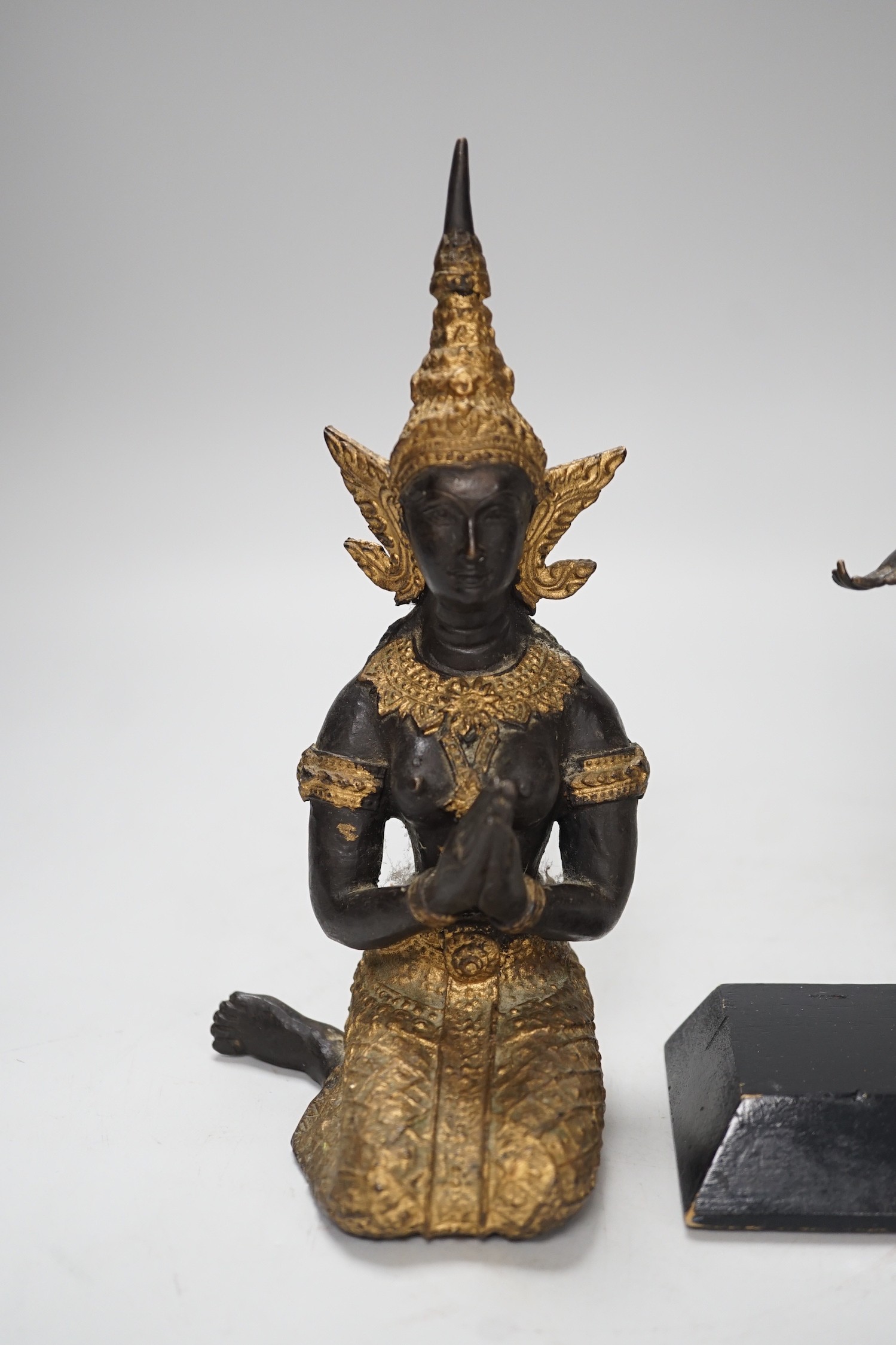 Two two colour Thai patinated metal figures and a hollow cast leopard. Tallest 25cm